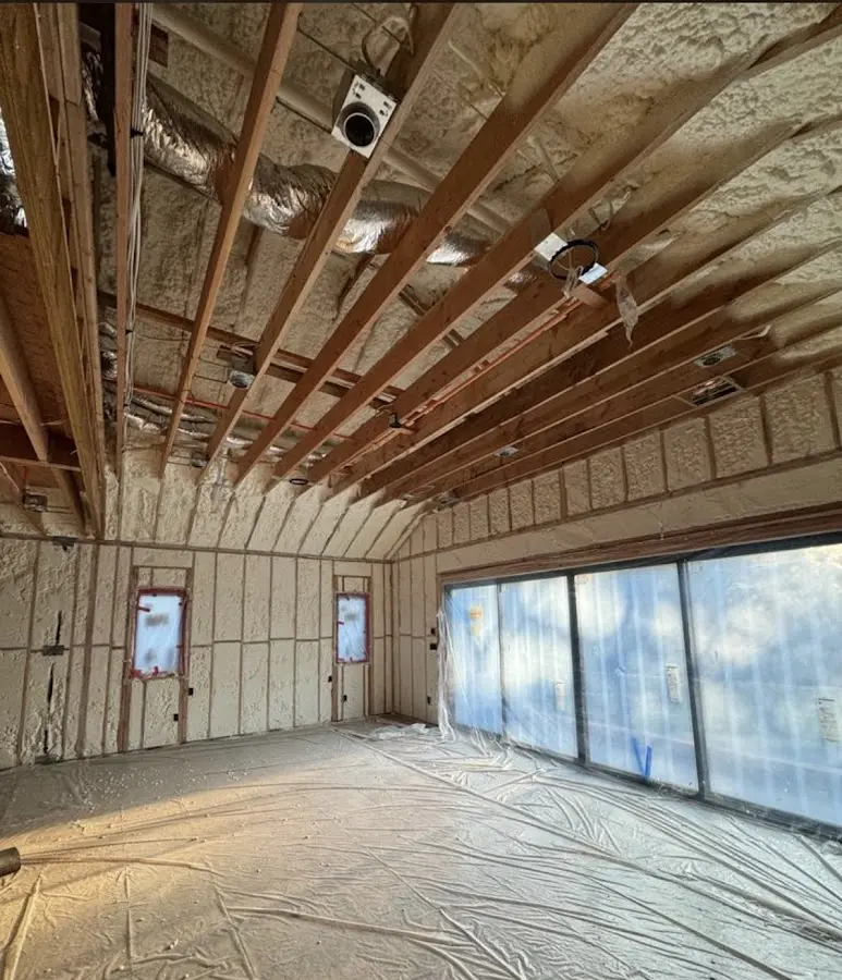 Interior walls and ceiling insulated with spray foam during new construction in Huntsville