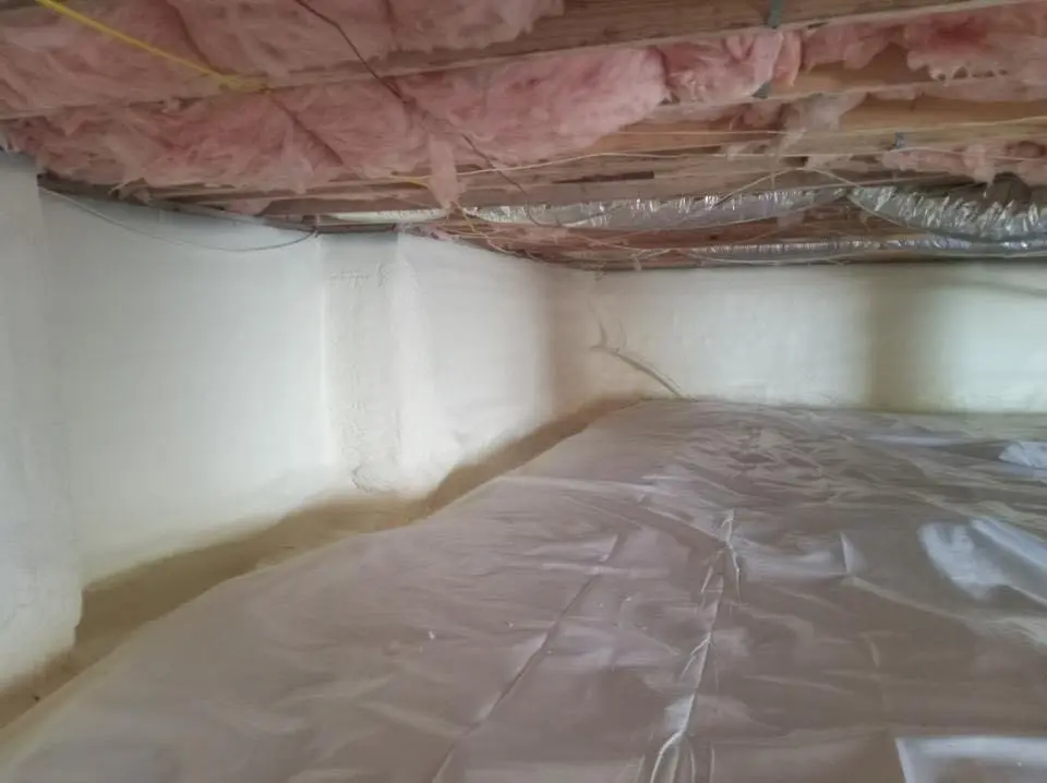 Crawl space encapsulation with closed-cell spray foam for Commercial Roof Restoration in Huntsville